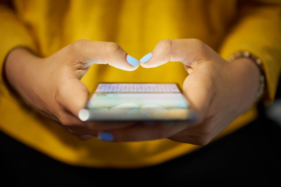 woman-sending-message-using-smartphone