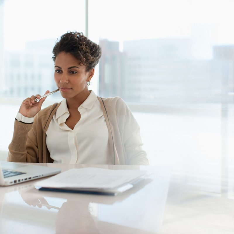 businesswoman-looking-at-laptop