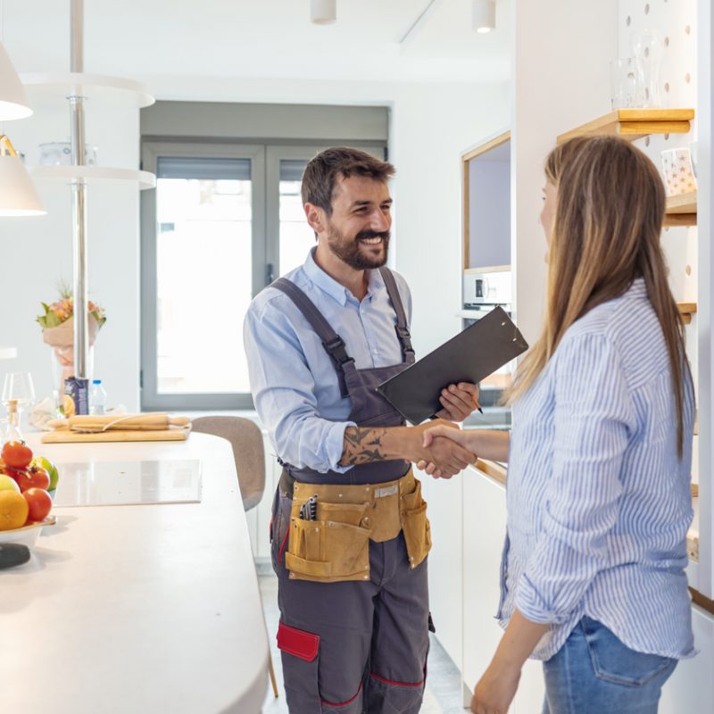 plumber-shaking-hands-with-woman