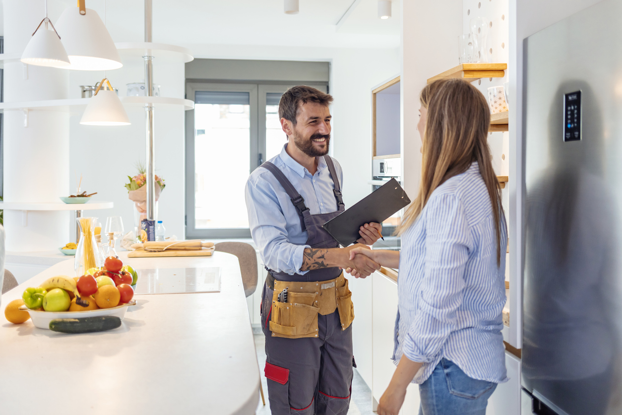 plumber-shaking-hands-with-woman