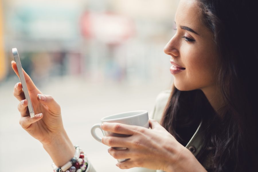 woman-using-smartphone-coffee-break